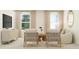Bright living room features natural light, stylish seating, neutral decor, and a large TV at 529 Morning Light Dr, Angier, NC 27501