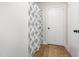 Bathroom featuring shower with gray patterned shower curtain and wood-look flooring at 5337 Nc Hwy 96, Selma, NC 27576