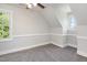 Bright bedroom features neutral paint, modern trim, carpet, and two windows with a ceiling fan for added comfort at 5337 Nc Hwy 96, Selma, NC 27576