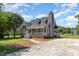 Well-maintained home with covered porch, brick foundation, and mature trees in a suburban setting at 5337 Nc Hwy 96, Selma, NC 27576