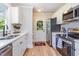 Modern kitchen features white cabinets, stainless steel appliances, and stylish countertops at 5337 Nc Hwy 96, Selma, NC 27576