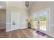 Bright living area featuring french doors leading to a deck and a charming 'hello' sign at 5337 Nc Hwy 96, Selma, NC 27576