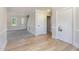 Inviting living room with new grey carpeting and light wood flooring at 5337 Nc Hwy 96, Selma, NC 27576