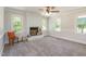 Spacious living room features a painted brick fireplace, neutral walls, carpet and trim at 5337 Nc Hwy 96, Selma, NC 27576