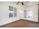 Cozy back porch with ceiling fan and lots of windows at 5456 Grand Traverse Dr, Raleigh, NC 27604
