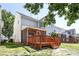 Grassy backyard featuring a wood deck and landscaped areas at 5456 Grand Traverse Dr, Raleigh, NC 27604