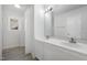 Bathroom featuring double sink vanity, white cabinets, and a large mirror at 5456 Grand Traverse Dr, Raleigh, NC 27604