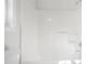 A bright white bathroom featuring a bathtub and window at 5456 Grand Traverse Dr, Raleigh, NC 27604