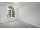 Bright bedroom features neutral carpet, and a large arched window at 5456 Grand Traverse Dr, Raleigh, NC 27604