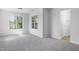 Bedroom featuring two windows and neutral carpet and paint at 5456 Grand Traverse Dr, Raleigh, NC 27604