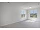 Spacious bedroom with carpet and two large windows offering natural light at 5456 Grand Traverse Dr, Raleigh, NC 27604