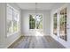Bright dining area featuring three windows and vinyl flooring at 5456 Grand Traverse Dr, Raleigh, NC 27604