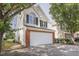 Well-maintained home features a spacious two-car garage and classic architectural details at 5456 Grand Traverse Dr, Raleigh, NC 27604