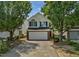 Charming two-story home featuring a two-car garage, landscaped yard, and classic architectural details at 5456 Grand Traverse Dr, Raleigh, NC 27604