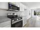 Modern kitchen featuring stainless steel appliances and light countertops and vinyl flooring at 5456 Grand Traverse Dr, Raleigh, NC 27604