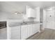 Open kitchen showcasing white cabinetry, granite countertops, and modern appliances at 5456 Grand Traverse Dr, Raleigh, NC 27604