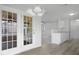 Open floor plan view of the kitchen, dining, and living room with neutral colors at 5456 Grand Traverse Dr, Raleigh, NC 27604