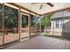 Spacious screened-in porch with view of trees and backyard at 5456 Grand Traverse Dr, Raleigh, NC 27604