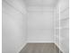 Walk-in closet with carpeted floor and shelving at 5456 Grand Traverse Dr, Raleigh, NC 27604