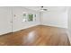 Bright living room featuring hardwood floors, fresh white paint, and natural light from the windows at 620 Wexford Dr, Raleigh, NC 27603