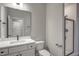 Modern bathroom featuring a vanity with drawers, a toilet, and a glass-enclosed shower at 63 W Victoria Ridge Dr # 31, Selma, NC 27576