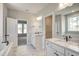 Luxury bathroom featuring double vanities, soaking tub, and walk-in closet at 63 W Victoria Ridge Dr # 31, Selma, NC 27576