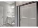 Elegant bathroom featuring a modern vanity, a toilet, and a walk-in shower with glass door at 63 W Victoria Ridge Dr # 31, Selma, NC 27576
