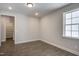 Spacious bedroom with hardwood floors, a large window for natural light, and an open closet at 63 W Victoria Ridge Dr # 31, Selma, NC 27576
