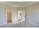 Neutral bedroom featuring closet, doorway to bathroom, and plush carpet at 63 W Victoria Ridge Dr # 31, Selma, NC 27576