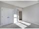 Bedroom showcasing a closet and doorway with sunlight streaming in at 63 W Victoria Ridge Dr # 31, Selma, NC 27576