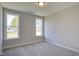 Bedroom featuring two large windows offering ample natural light and neutral walls at 63 W Victoria Ridge Dr # 31, Selma, NC 27576