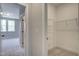 View from bedroom to a walk-in closet with wire shelving for ample storage at 63 W Victoria Ridge Dr # 31, Selma, NC 27576