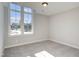Bright bedroom with large windows and plush gray carpeting at 63 W Victoria Ridge Dr # 31, Selma, NC 27576