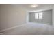 Bonus room with neutral walls, carpeting, and natural light at 63 W Victoria Ridge Dr # 31, Selma, NC 27576