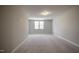 Bright carpeted bonus room featuring a window for natural light and neutral walls at 63 W Victoria Ridge Dr # 31, Selma, NC 27576