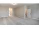 Bonus room with neutral walls, carpeting, and multiple doorways at 63 W Victoria Ridge Dr # 31, Selma, NC 27576