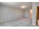 Spacious bonus room with plush carpeting and doorway at 63 W Victoria Ridge Dr # 31, Selma, NC 27576