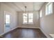A bright dining area with a stylish light fixture and a view of the backyard at 63 W Victoria Ridge Dr # 31, Selma, NC 27576