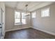 A bright dining area featuring a modern light fixture and hardwood floors at 63 W Victoria Ridge Dr # 31, Selma, NC 27576