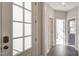 Bright entryway with white trim, hardwood floors, and a view through the sidelight to another room at 63 W Victoria Ridge Dr # 31, Selma, NC 27576