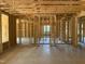 Open-concept home interior showcasing exposed framing, and concrete flooring ready for customization at 63 W Victoria Ridge Dr # 31, Selma, NC 27576