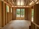 Exposed framing of a room with windows showing the surrounding wooded views at 63 W Victoria Ridge Dr # 31, Selma, NC 27576