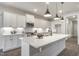 Contemporary kitchen with white cabinetry, stainless steel appliances, and a marble countertop island at 63 W Victoria Ridge Dr # 31, Selma, NC 27576