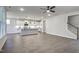 Spacious living area showcasing an open-concept design, hardwood floors, and staircase access at 63 W Victoria Ridge Dr # 31, Selma, NC 27576