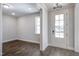 Bright living room features wood floors, natural light, and an open layout with a view of the entry at 63 W Victoria Ridge Dr # 31, Selma, NC 27576
