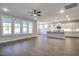 Open-concept living space featuring wood floors, ceiling fan and an island kitchen with pendant lights at 63 W Victoria Ridge Dr # 31, Selma, NC 27576