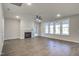 Bright living room with a fireplace, hardwood floors, and ample natural light from large windows at 63 W Victoria Ridge Dr # 31, Selma, NC 27576