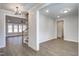 Open-concept living space with wood floors, neutral paint, and view of the staircase and living area at 63 W Victoria Ridge Dr # 31, Selma, NC 27576