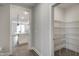 Walk-in pantry with wire shelving for optimal kitchen storage at 63 W Victoria Ridge Dr # 31, Selma, NC 27576