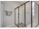 Modern glass-enclosed shower with white subway tile and black hardware at 63 W Victoria Ridge Dr # 31, Selma, NC 27576